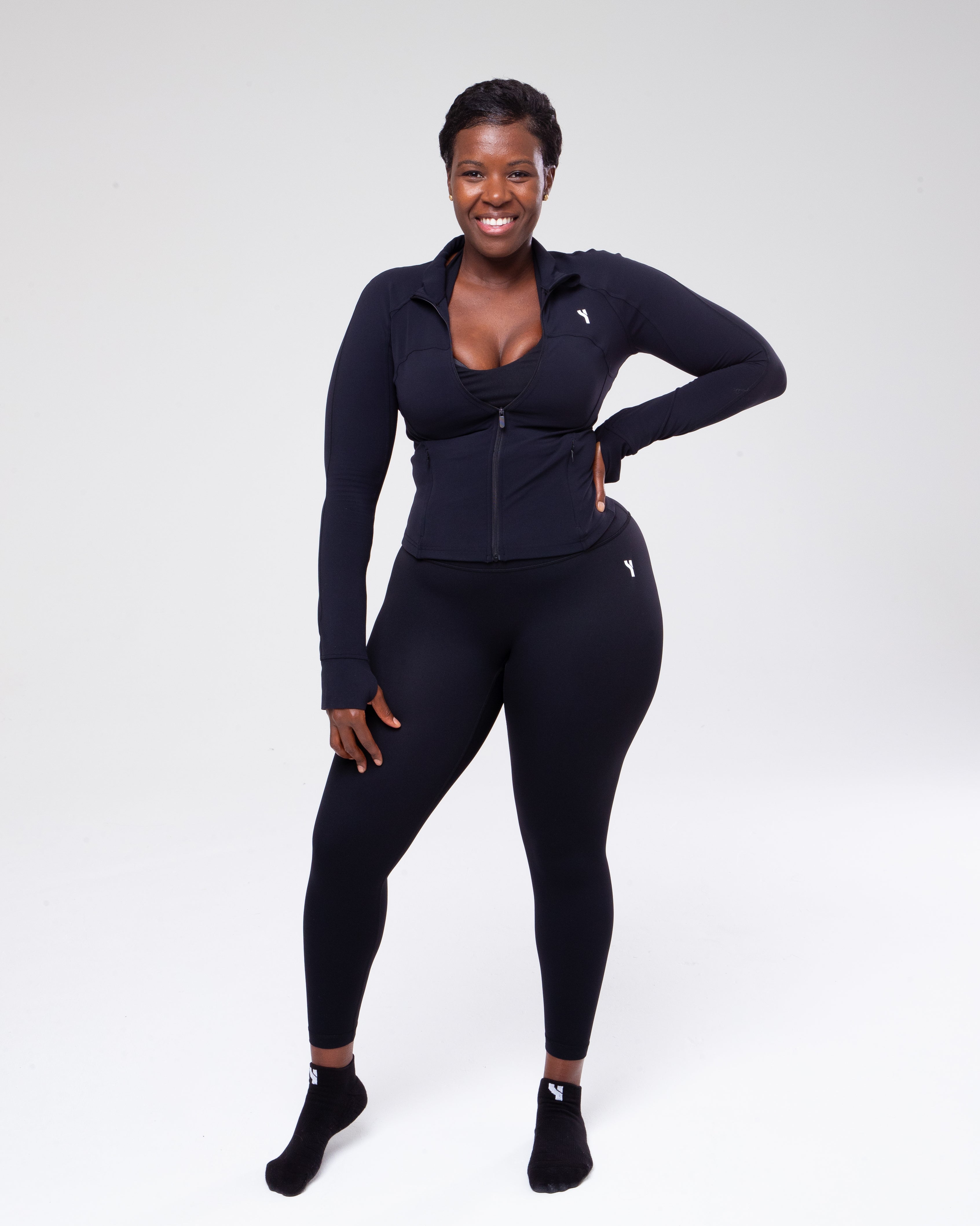 Allure Jumpsuit in black full height model shot from the front active pose