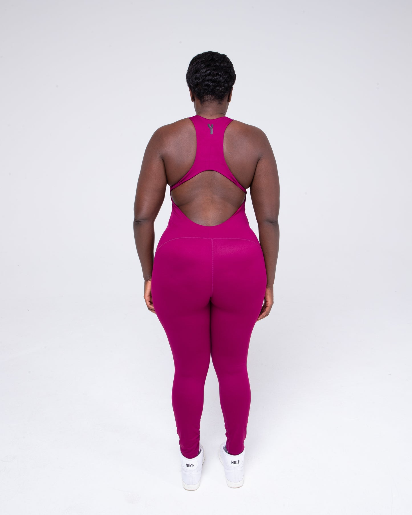 Allure Jumpsuit in wine colour full height model shot from the rear