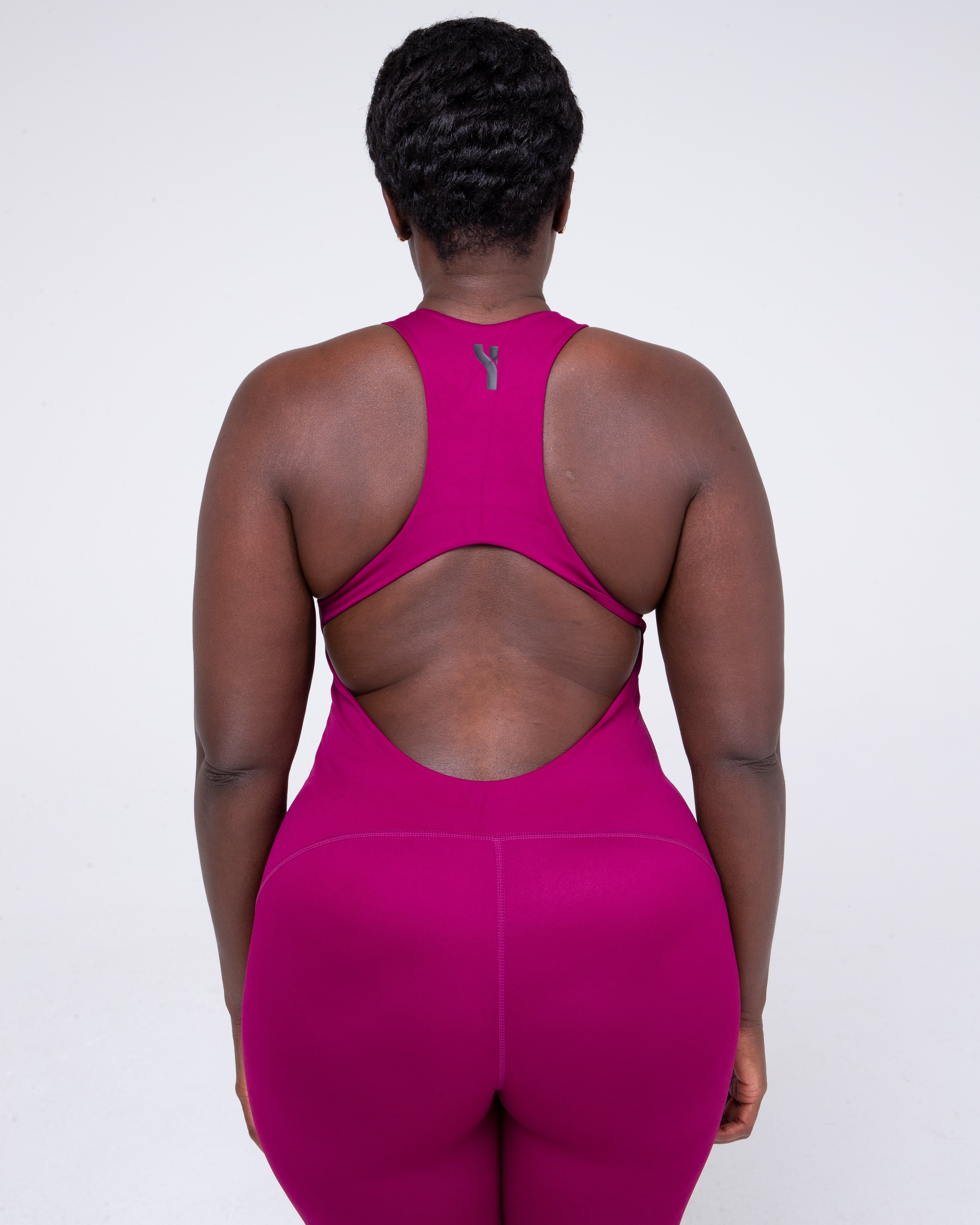 Allure Jumpsuit in wine colour full height model shot zoomed from the rear