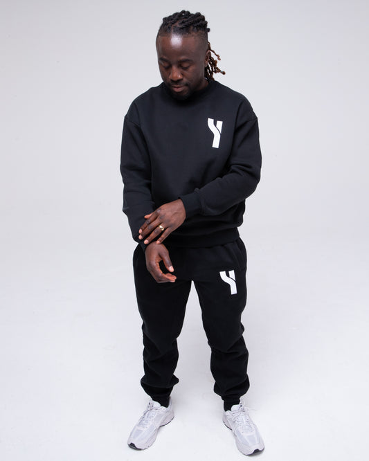 Cosy Crewneck Sweater in black full height model shot from the front active pose