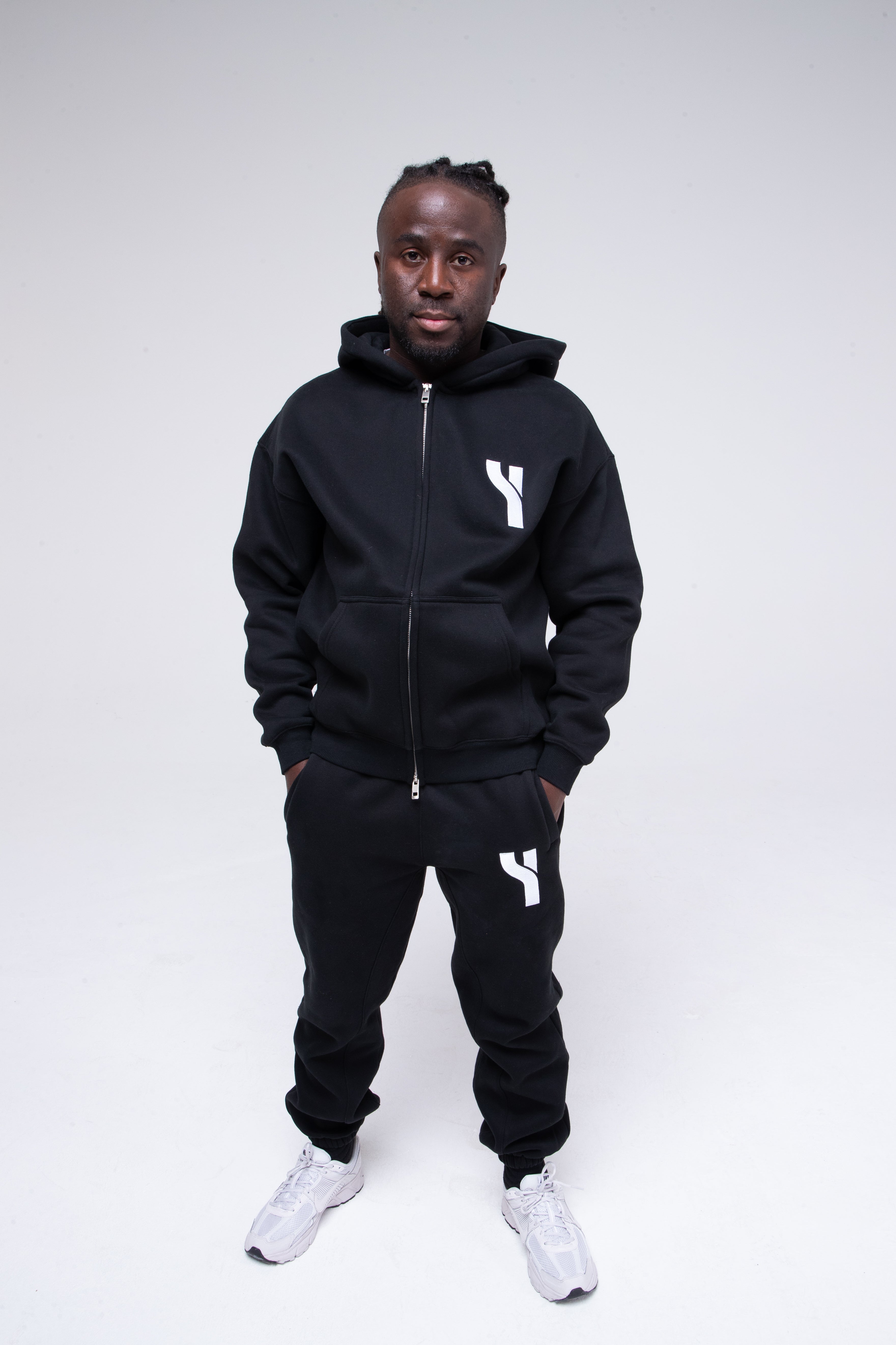Cosy Zip Hoodie in black full height model shot from the front active pose