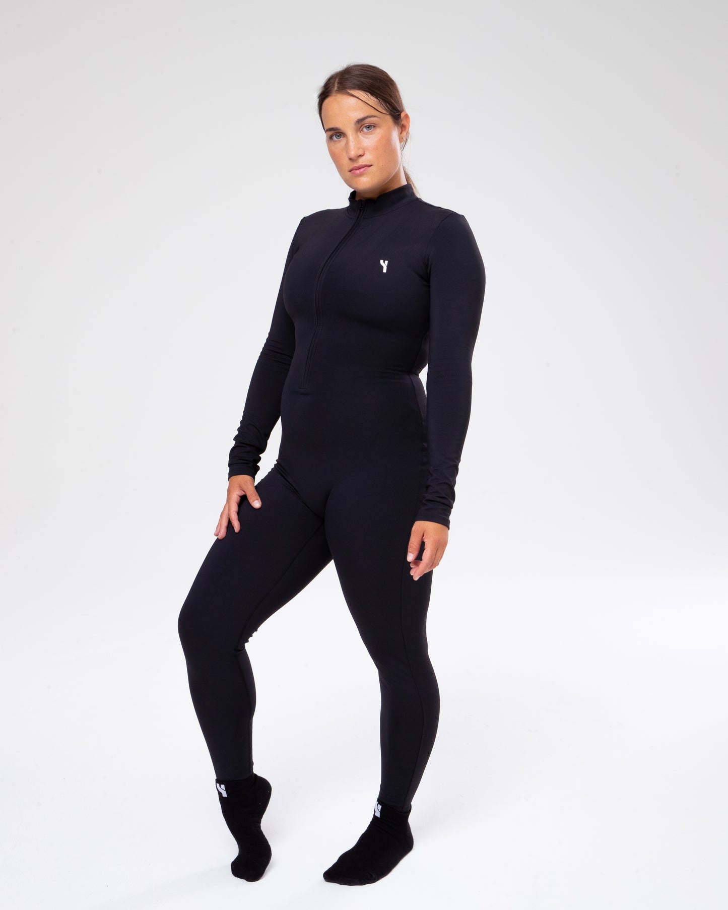 Sculpt Fleece Jumpsuit in black full height model shot from the front active pose