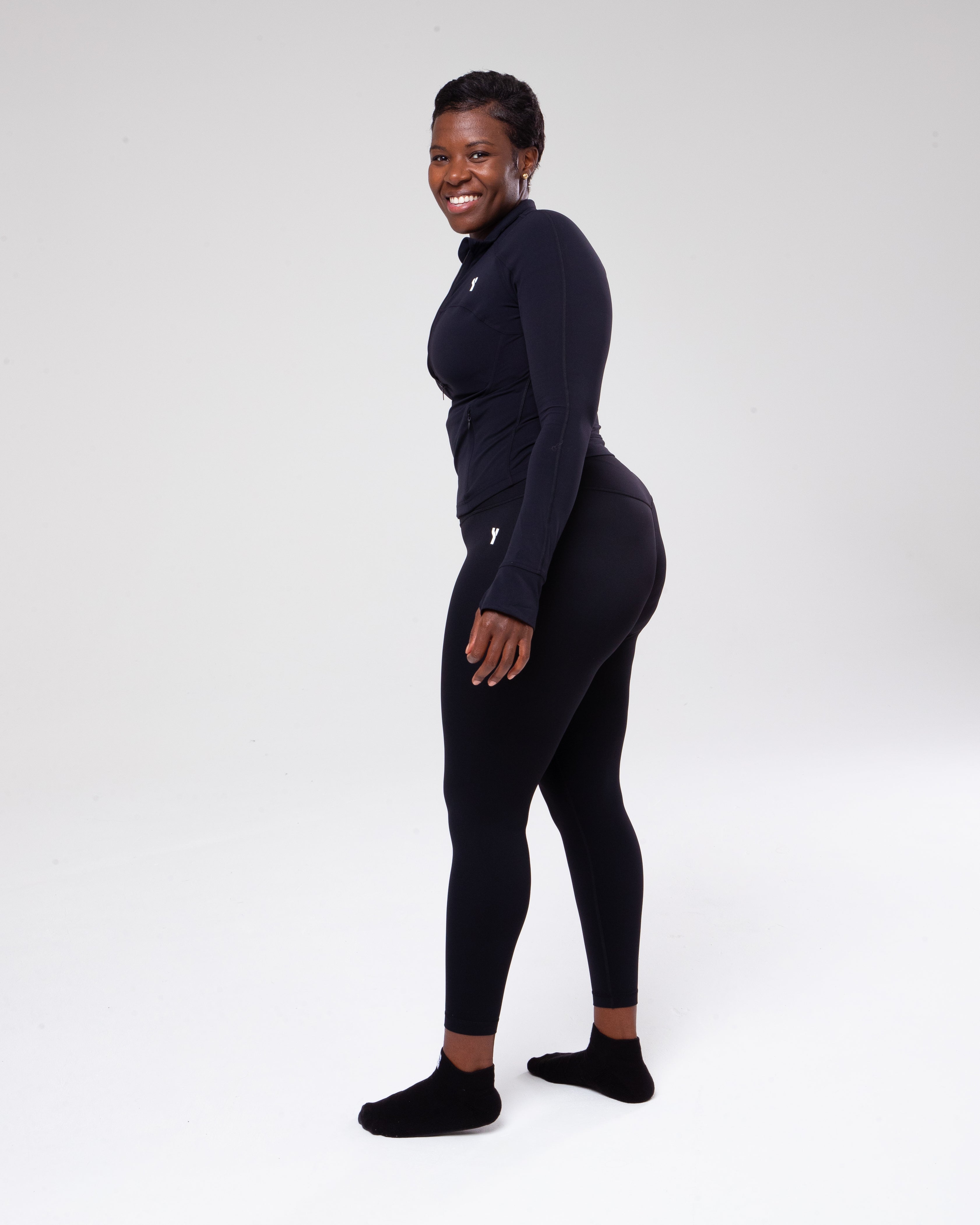 Allure Jumpsuit in black full height model shot from the side