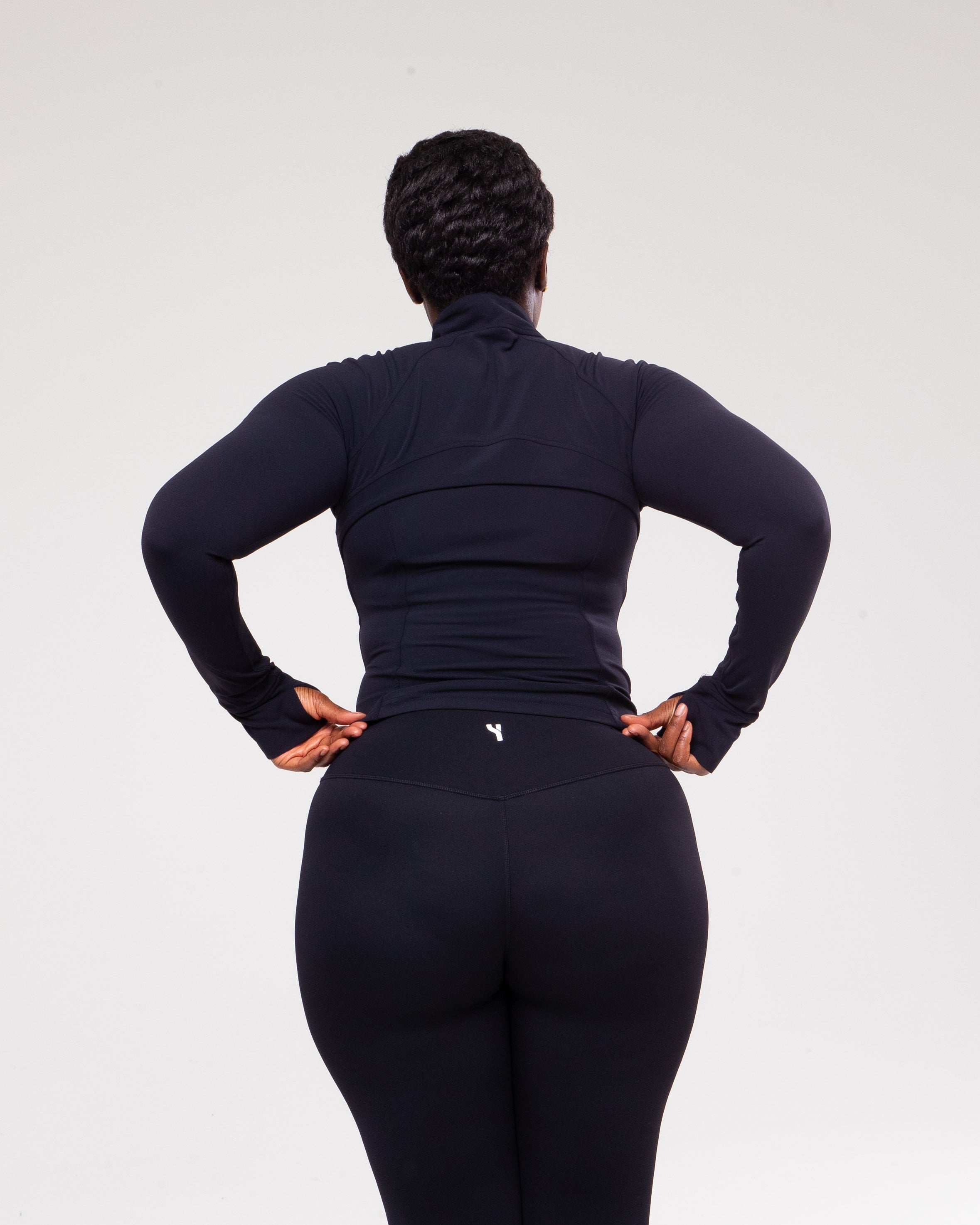 Sculpt 1/4 Zip Jacket in black model shot zoomed for product detail from the back