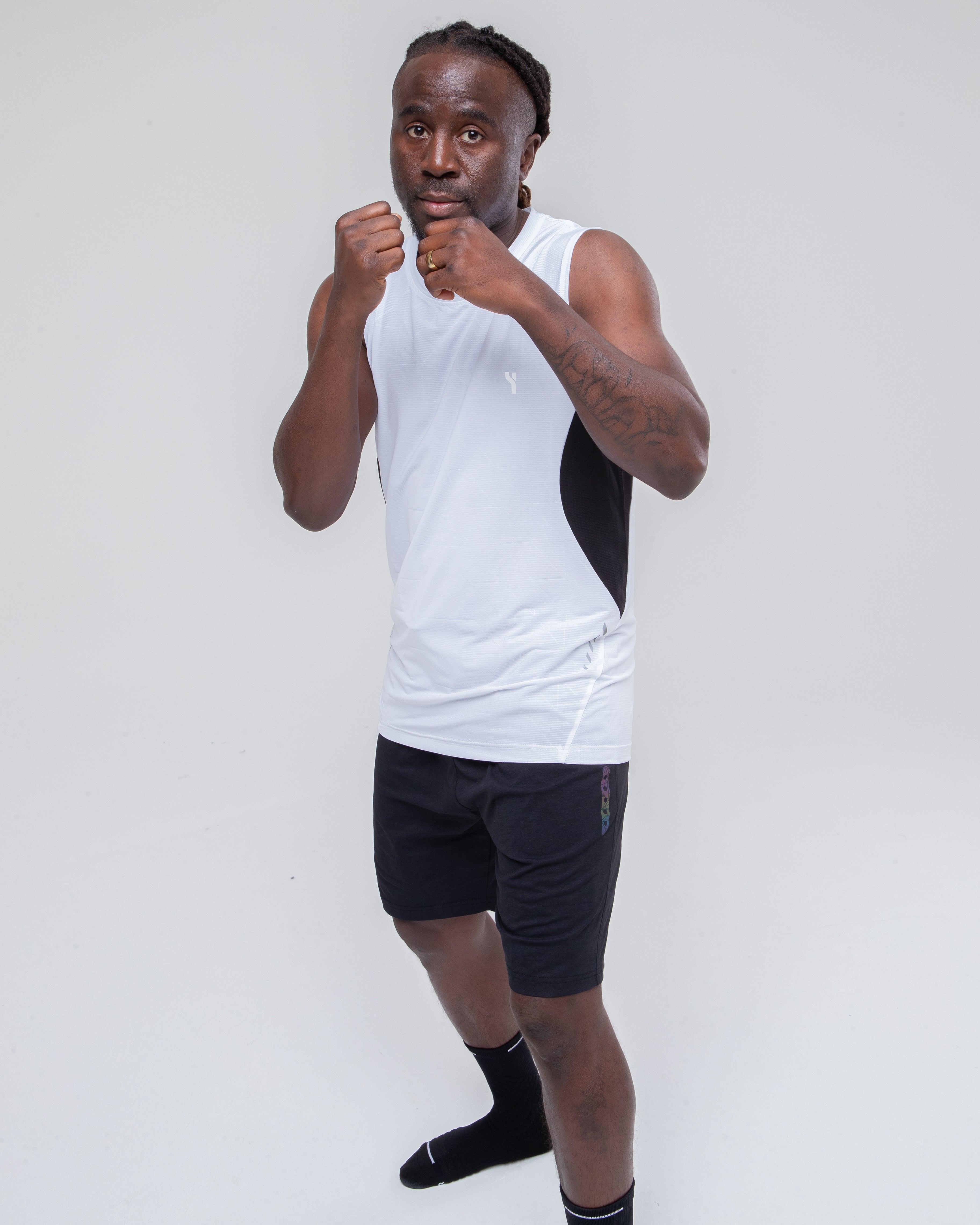 Men’s Sculpt Reflective Vest in white model in active pose from the front