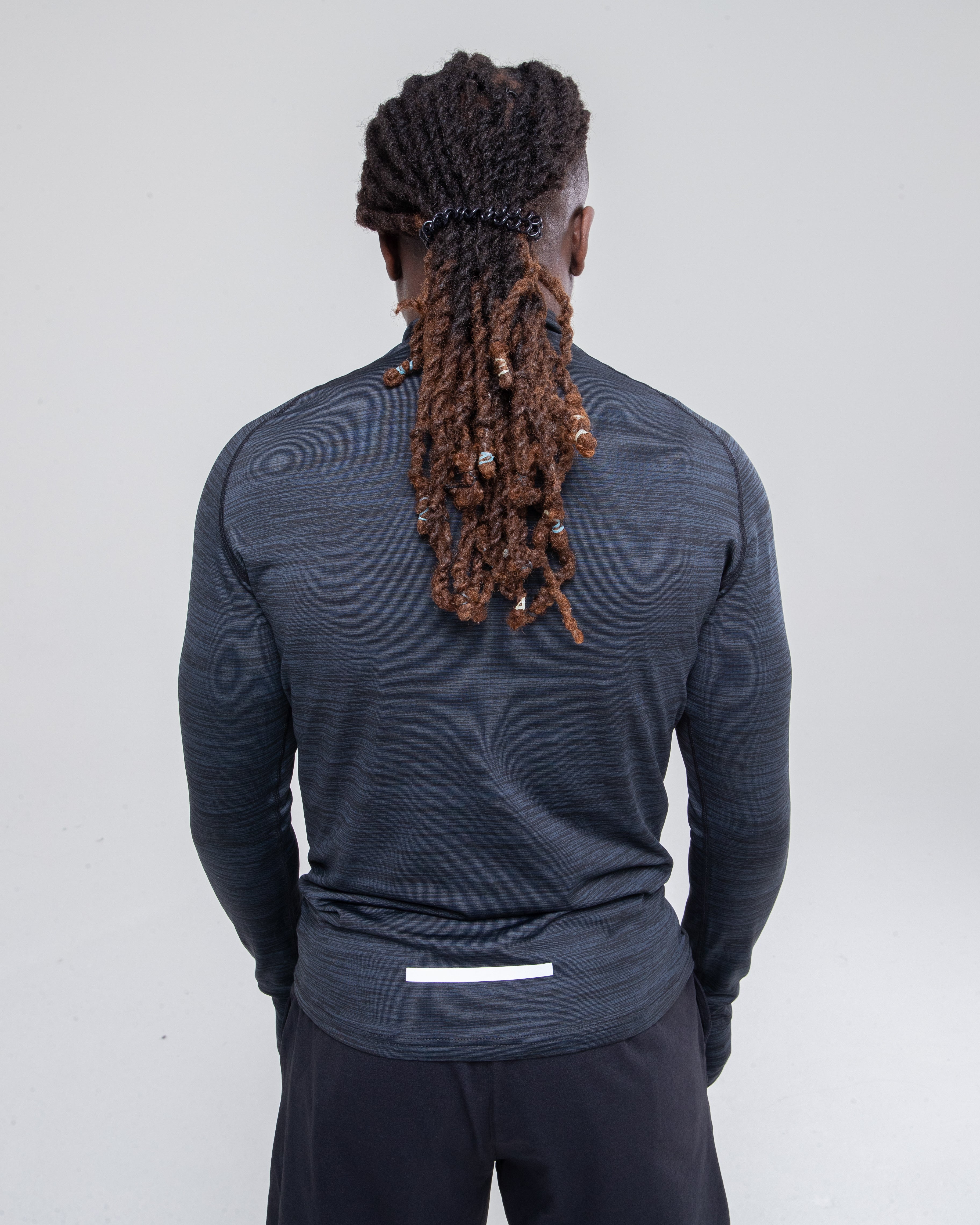 Men’s Sculpt 1/4 Zip Top in black zoomed model shot to detail the back