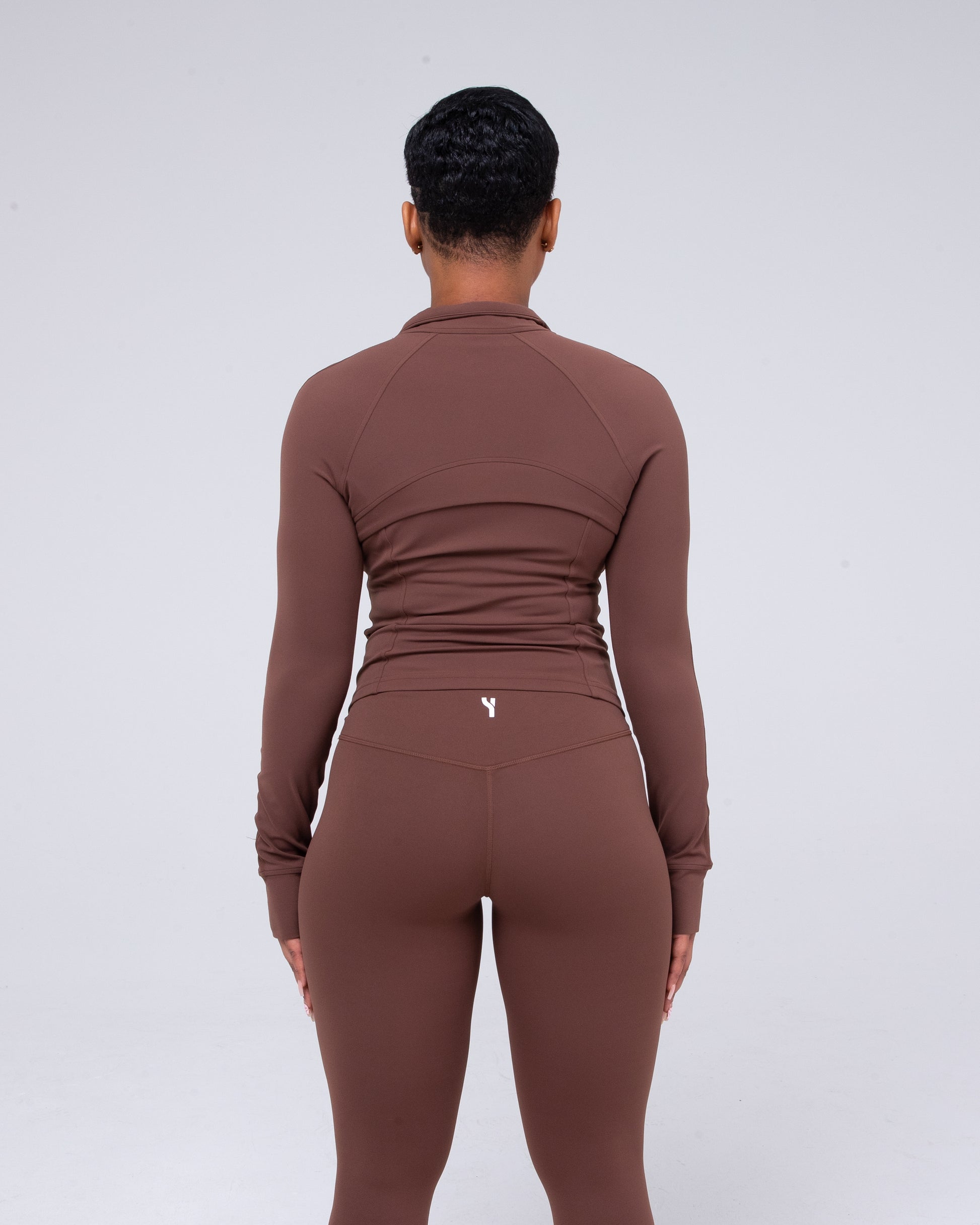 Sculpt 1/4 Zip Jacket in brown detailed from the back