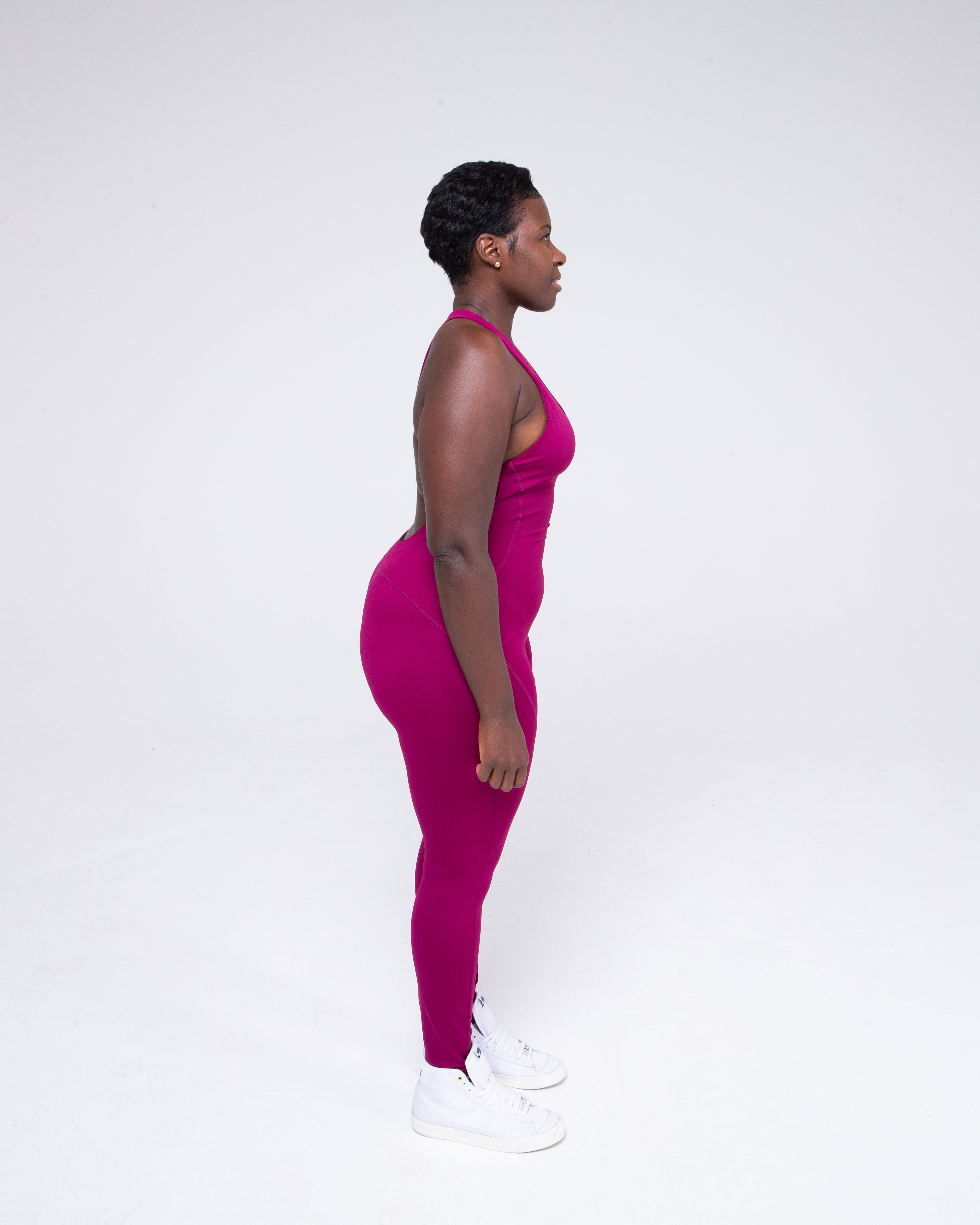 Allure Jumpsuit in wine colour full height model shot from the side