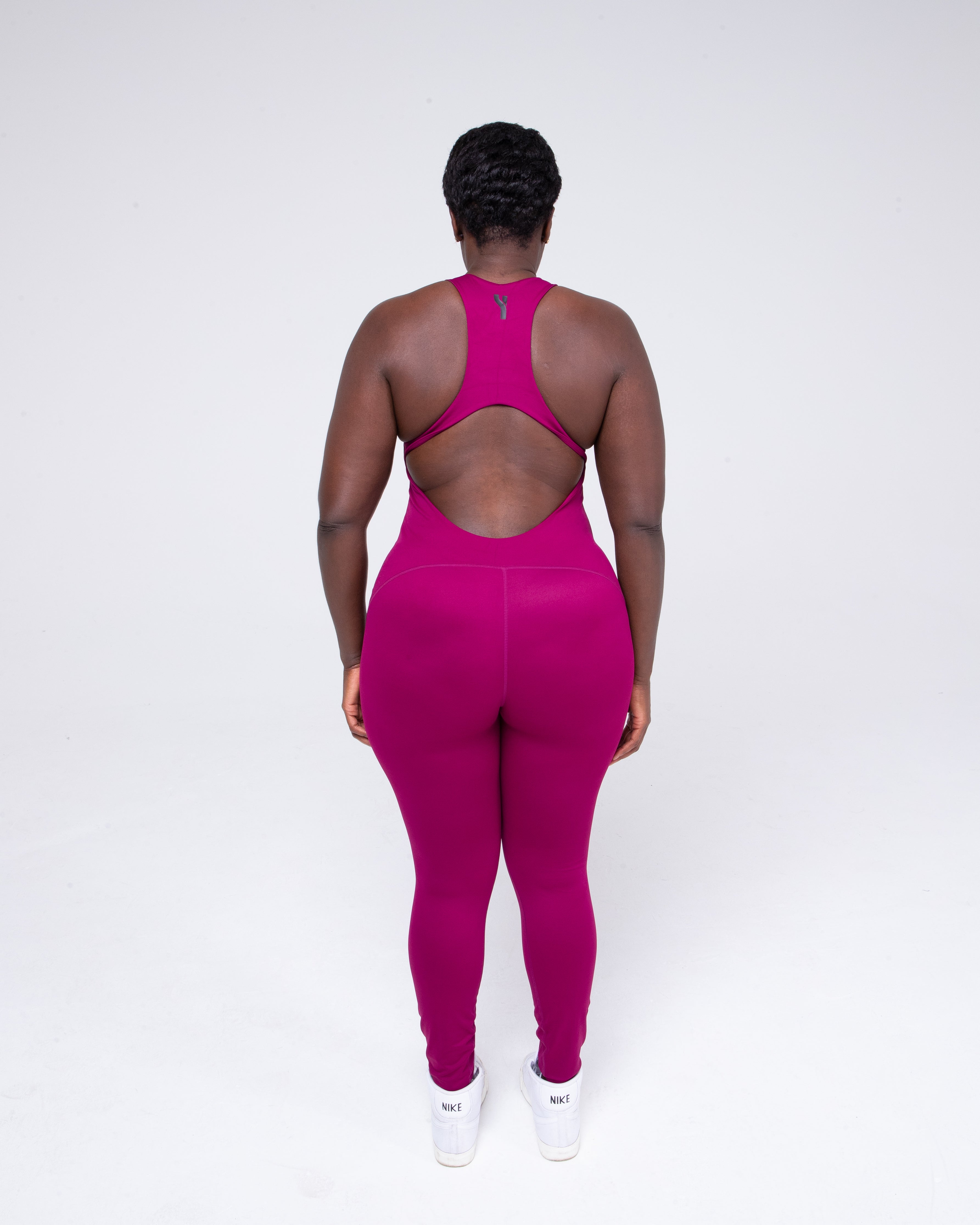 Allure Jumpsuit in wine colour full height model shot from the rear
