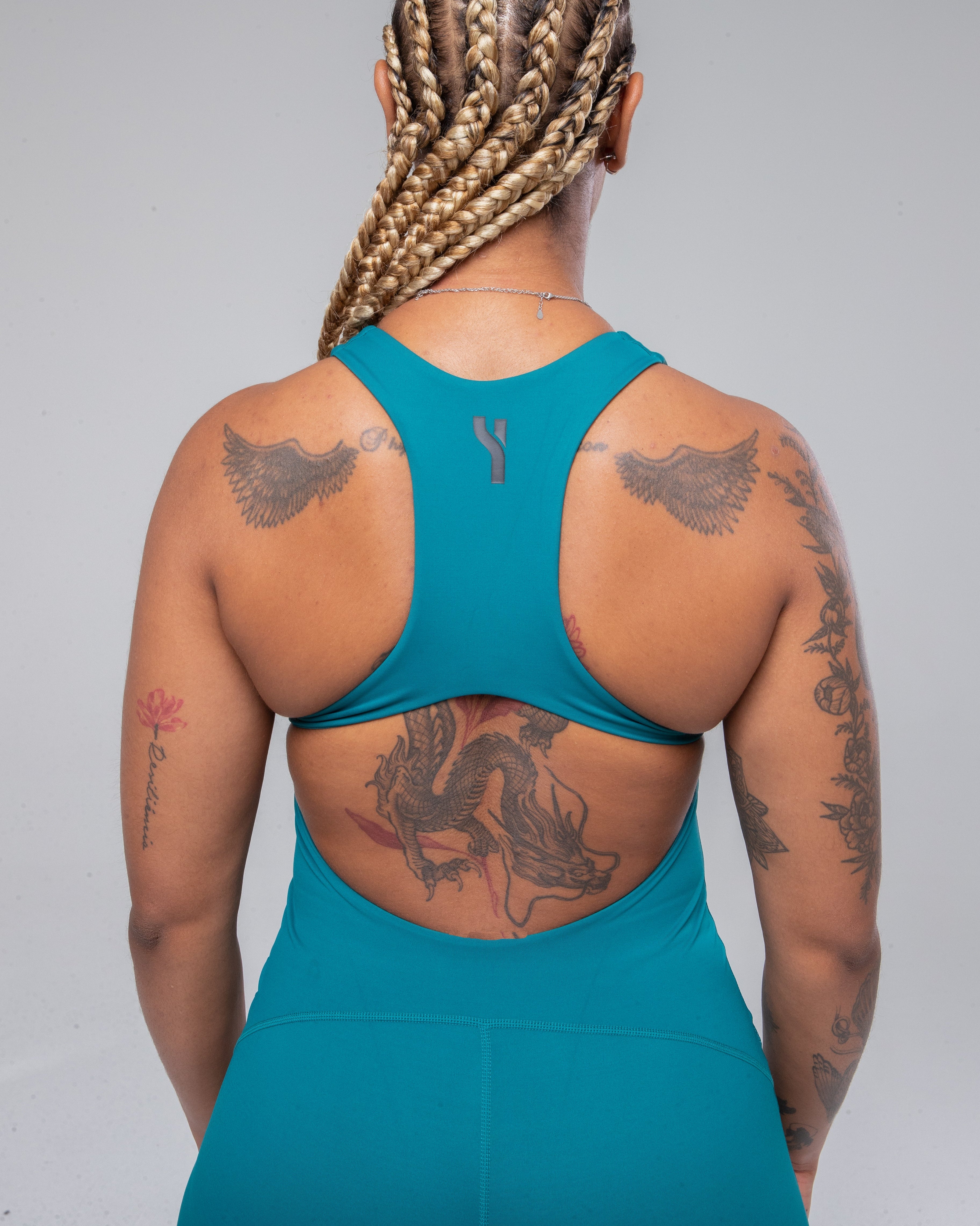  Allure Jumpsuit in Teal zoomed and detailed from the back